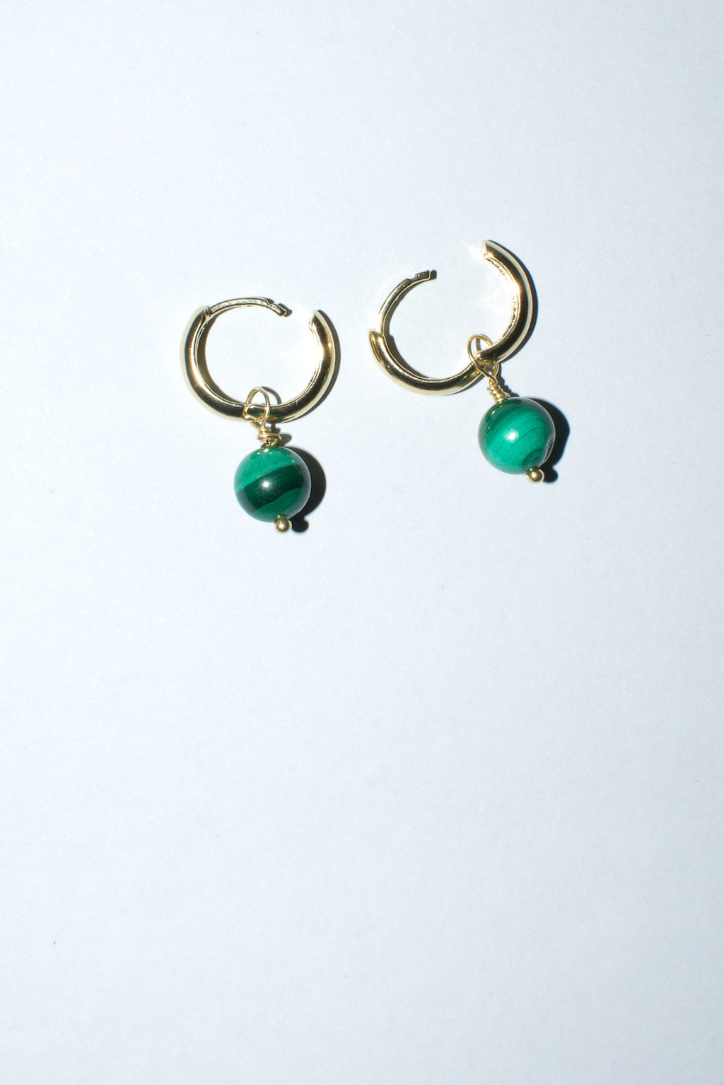 18ct gold filled hoop earrings with malachite gemstones by Anouk Gania. Open to show hoop click clasp system.