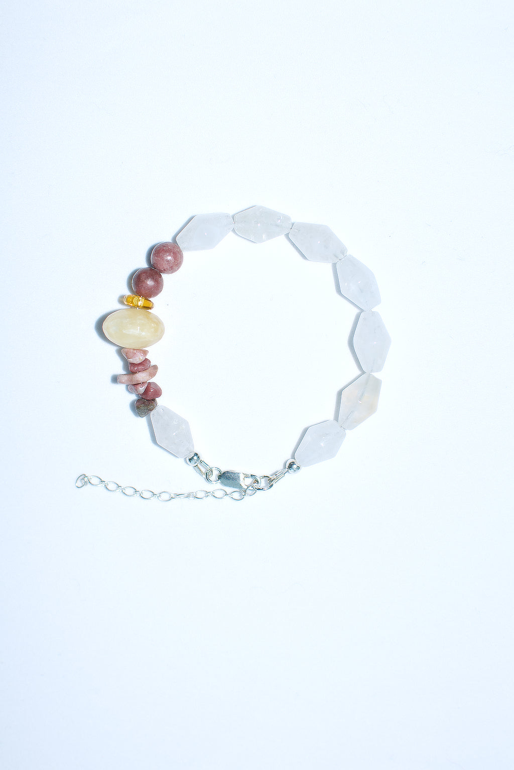 Semiprecious gemstone bracelet featuring faceted quartz, yellow jade and rhodolite stones.  Sterling silver clasp and extender chain  Handmade in Melbourne by Anouk Gania