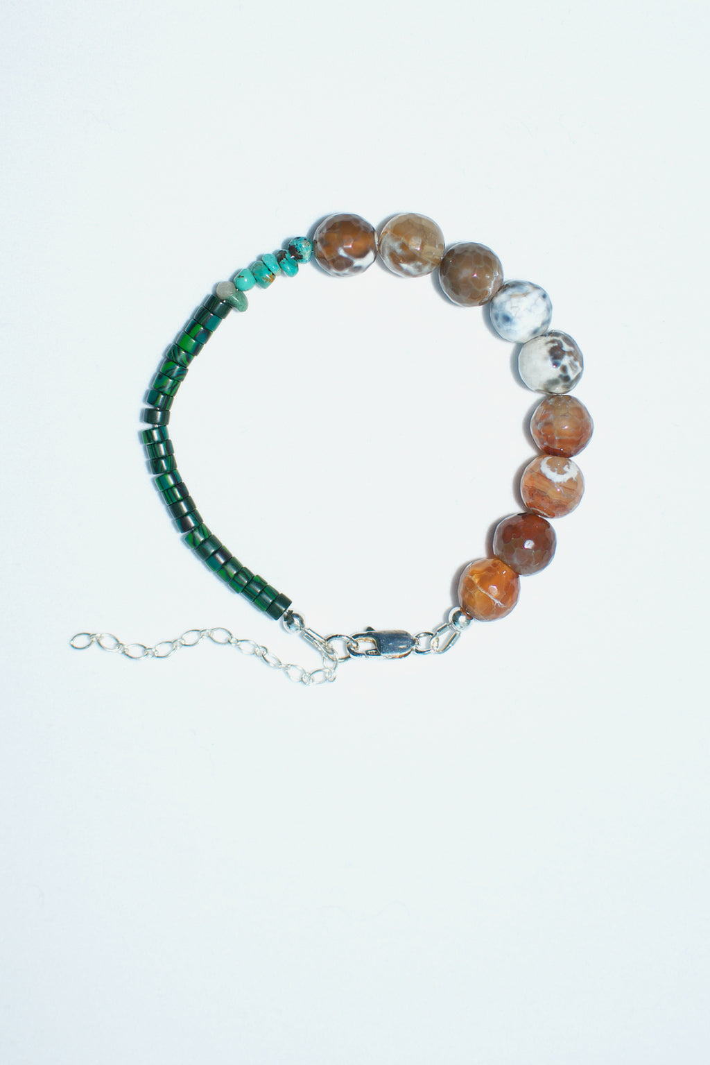 Semiprecious gemstone bracelet by Anouk Gania, featuring agate, green howlite and turquoise stones. Sterling silver clasp and extender chain