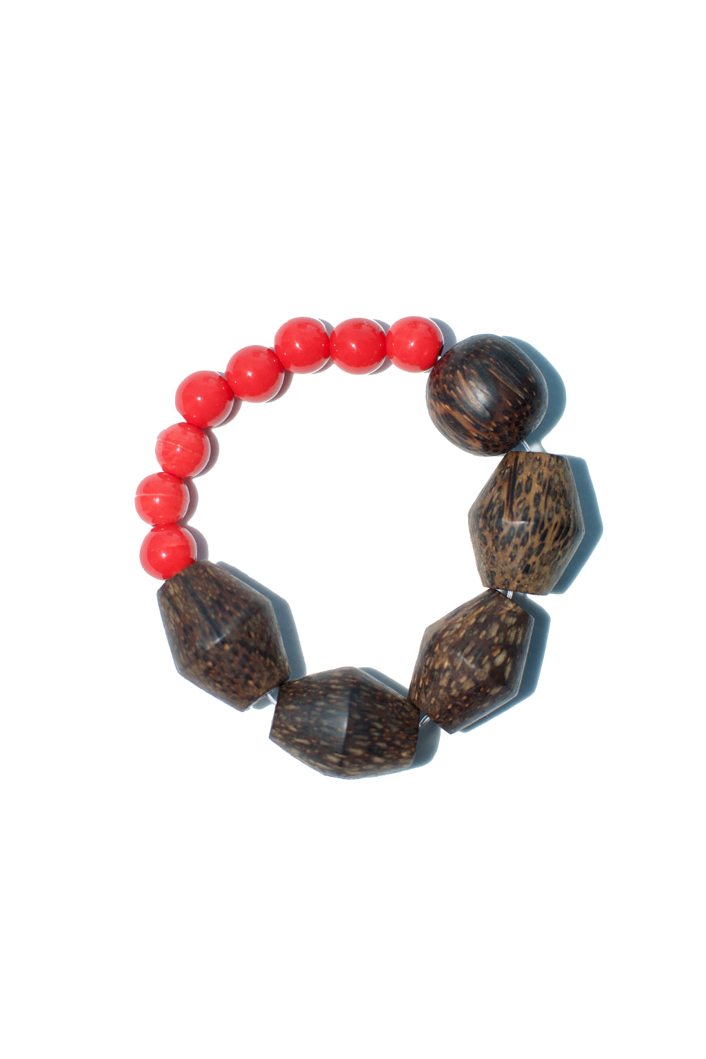 A chunky stretch bracelet from Anouk Gania featuring reclaimed wood and red ceramic beads.&nbsp;  Stretchy elastic bracelet fits most.  Handmade in Australia.